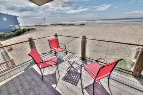 Relax on the deck and watch the kids playing in the sand.