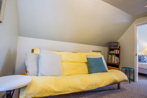 Curl up in this bright and comfy futon.