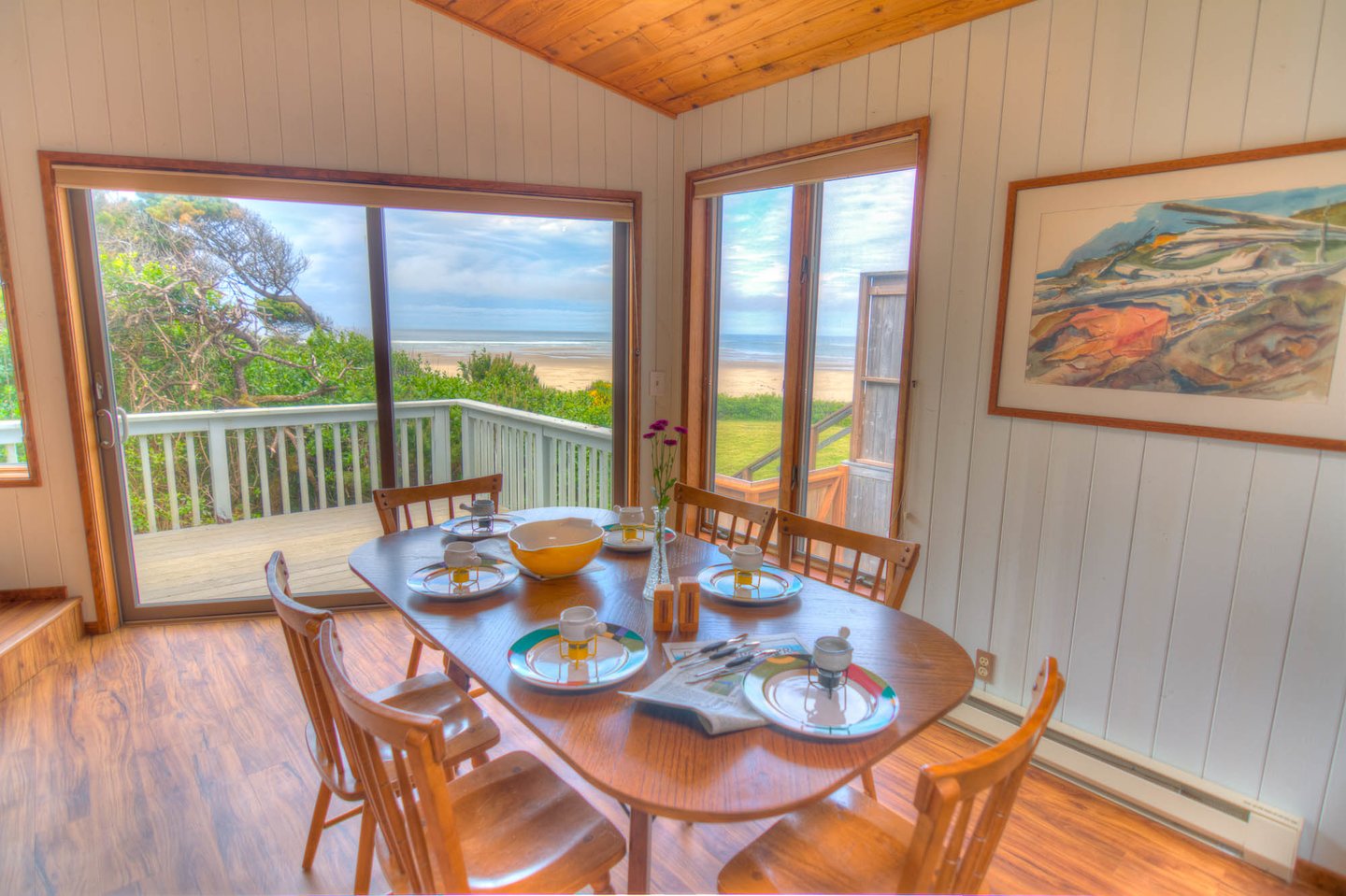 The dining room has a sliding glass door that opens on to the deck to allow the ocean breeze in!