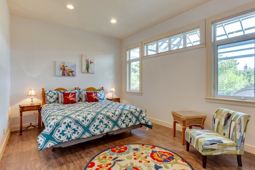 A colorful downstairs bedroom with a king bed that can be split in to two twins with advance notice.