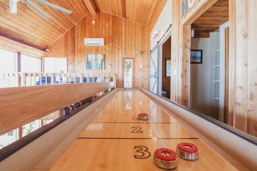 Enjoy a game of shuffleboard upstairs.