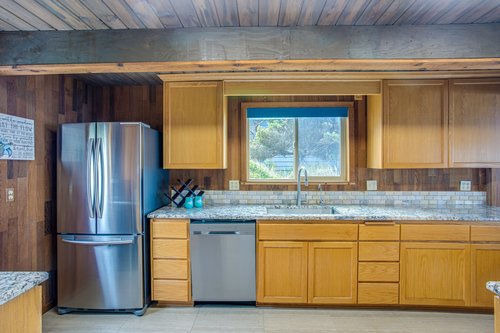 Enter into the warm kitchen with lots of natural light.