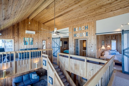 The upstairs open loft has two sitting areas and two bedrooms!