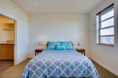 The master bedroom upstairs with lots of natural light.