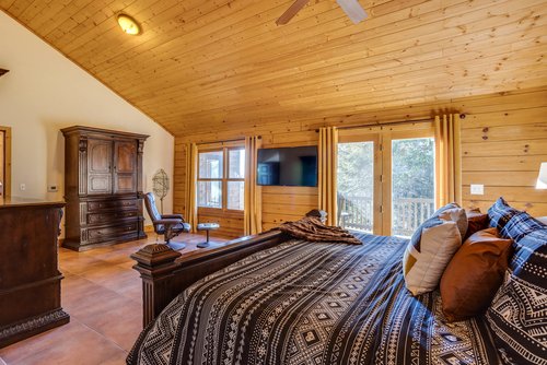 Access the deck or watch some television in the primary bedroom.