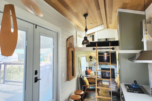 French doors to the deck gives more living space when open.